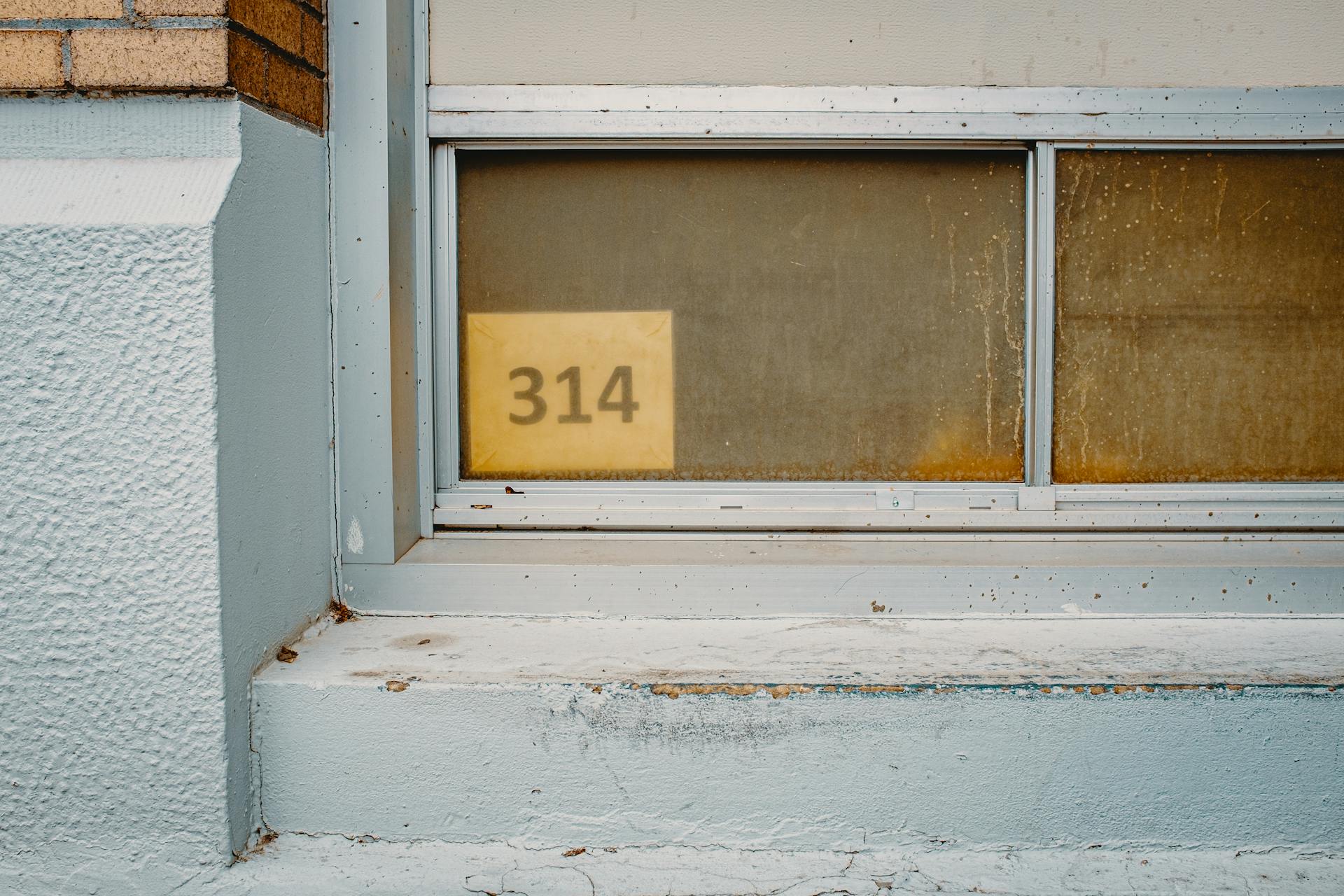 A picture showing the number 314 in a window.
